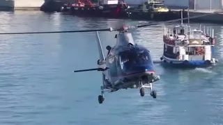 Agusta 109 flying at Barcelona port