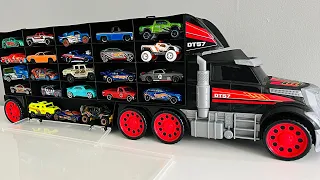 Small die cast model cars being carried by transportation vehicles - 4K Video