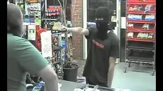 Shopkeeper stares down would-be gun-wielding robber