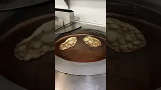 Making naan in a tandoor oven