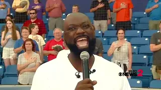 Singing principal who went viral performs national anthem