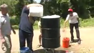 Crushing a 55 gallon steel drum using atmospheric pressure