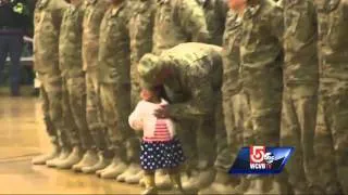 Girl races to hug soldier dad