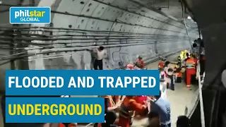 Firefighters rescue trapped passengers from flooded subway in China