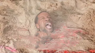 The father was buried in the sand and instantly struck by lightning.