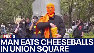 Hundreds turn out to watch man eat cheeseballs