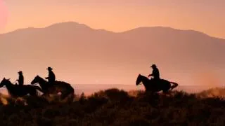 Slow Motion Silhouette Shot Of Cowboys Galloping  Horses  In 4K & Ultra HD Stock Footage