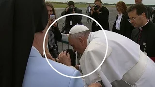 Pope stops car to bless child in wheelchair