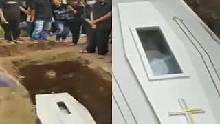 This Corpse Waves To Mourners Through Coffins Glass Panel (Daily Dose | Scary).