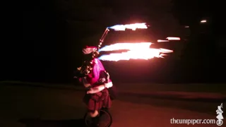 Unicyling Darth Vader Santa Claus Plays Flaming Bagpipes at Night