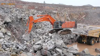 Hitachi 870 LCH excavator loading rock in a quarry.