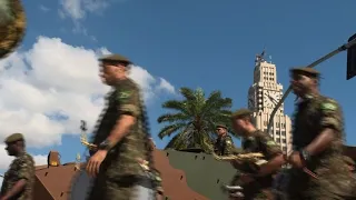 Brazilians watching military parade react to attack on Bolsonaro