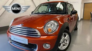 A cherished MINI 1.6i Automatic, in desirable Spice Orange with just 26,000 miles - SOLD!