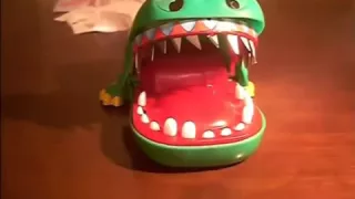 Playing phsyco Crocodile dentist with real razor-blades!  Funny!!!