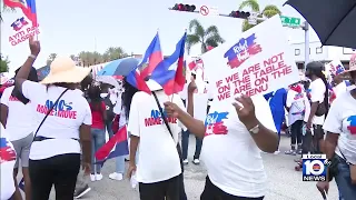 Protestors march in North Miami against the humanitarian crisis in Haiti