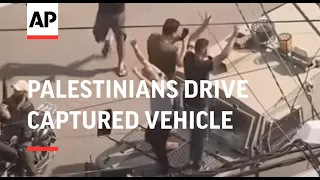 Celebrations as Palestinians drive captured Israeli military vehicle into Gaza City