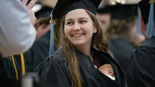 Woman receives diploma with 10-day-old baby tucked in graduation gown