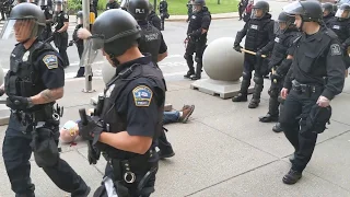 Two Buffalo police officers shove a man to the ground in front of City Hall (WARNING: GRAPHIC)