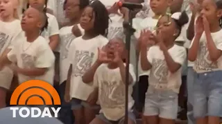 Little girl steals the show at kindergarten graduation performance