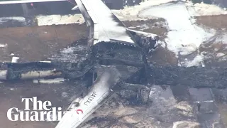 Aerials show plane wreckage after crash at Japan's Haneda airport