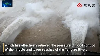 Three Gorges Dam opens three flood discharging outlets to ease the flood's impact