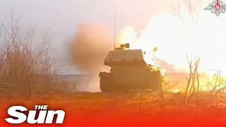 Russian soldiers fire self-propelled Howitzers at Ukrainian battlefield targets