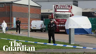 Essex lorry deaths: police bow their heads as bodies of 39 people are moved