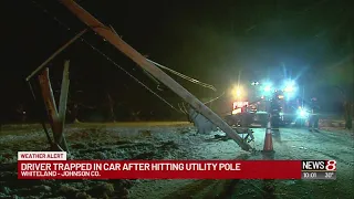 Driver trapped in car after hitting utility pole