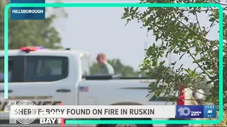 Law enforcement investigate after body found on fire in Ruskin field