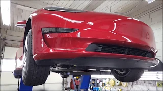 Underneath a Tesla Model 3 - undercarriage inspection