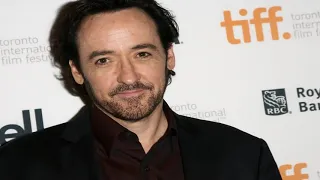 John Cusack ‘attacked by Chicago police’ filming burning car during riots as protesters city set abl