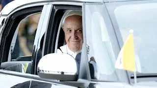 Watch: Pope arrives in U.S., rides off in a Fiat