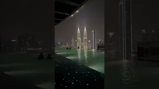 "Swimming in the Sky: Night View of KL Tower | The FACE Suites Infinity Pool"