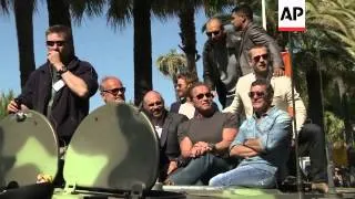 The star-studded cast of the new action movie arrive in Cannes on tanks