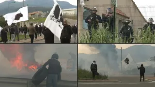 Corsican protesters hold bonfire, taunt riot police outside their barracks | AFP