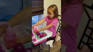 Washing dishes in minnie mouse sink