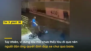 Vượt rào chắn đường sắt, xe đạp suýt bị tàu hỏa 'nuốt chửng' 