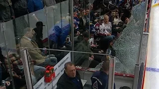 Excited fan accidentally shatters glass in penalty box
