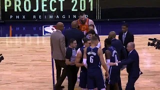 Kristaps Porzingis fights Aron Baynes