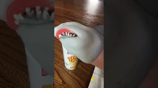 Shark puppet eats cheese