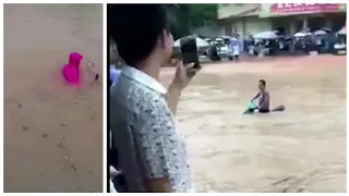 Guy rides motorcycle underwater in China Floods