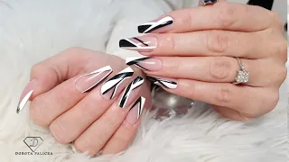 Nails trends 2022. Geometric nail art. Black and white nails.