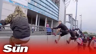 Ticketless fans rush Wembley Stadium security barriers at England vs Italy Euro 2020 final