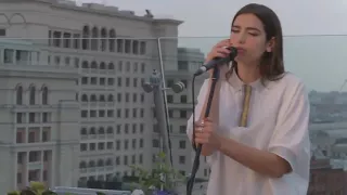 Dua Lipa on a rooftop in Moscow