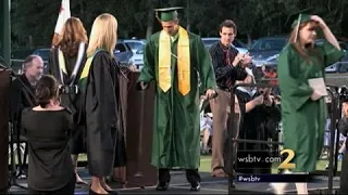 GREAT VIDEO: Paralyzed student walks on graduation day