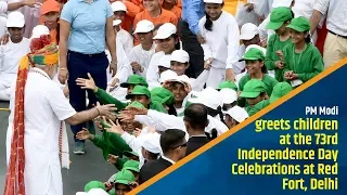 PM Modi greets children at the 73rd Independence Day Celebrations at Red Fort, Delhi