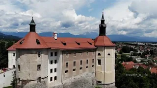 Aerial/Drone View of Medieval Skofja Loka Castle overlooking the beautiful old town