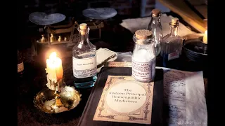 Apothecary 1800s using a balance scale for weighing and measuring different herb combinations. ASMR