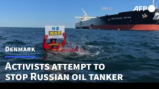 Greenpeace activists protest against oil tanker from Russia in Danish waters | AFP