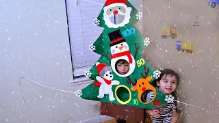 Playing with Festive Christmas Tree Ball Toss Game for Kids - Happy Holidays!